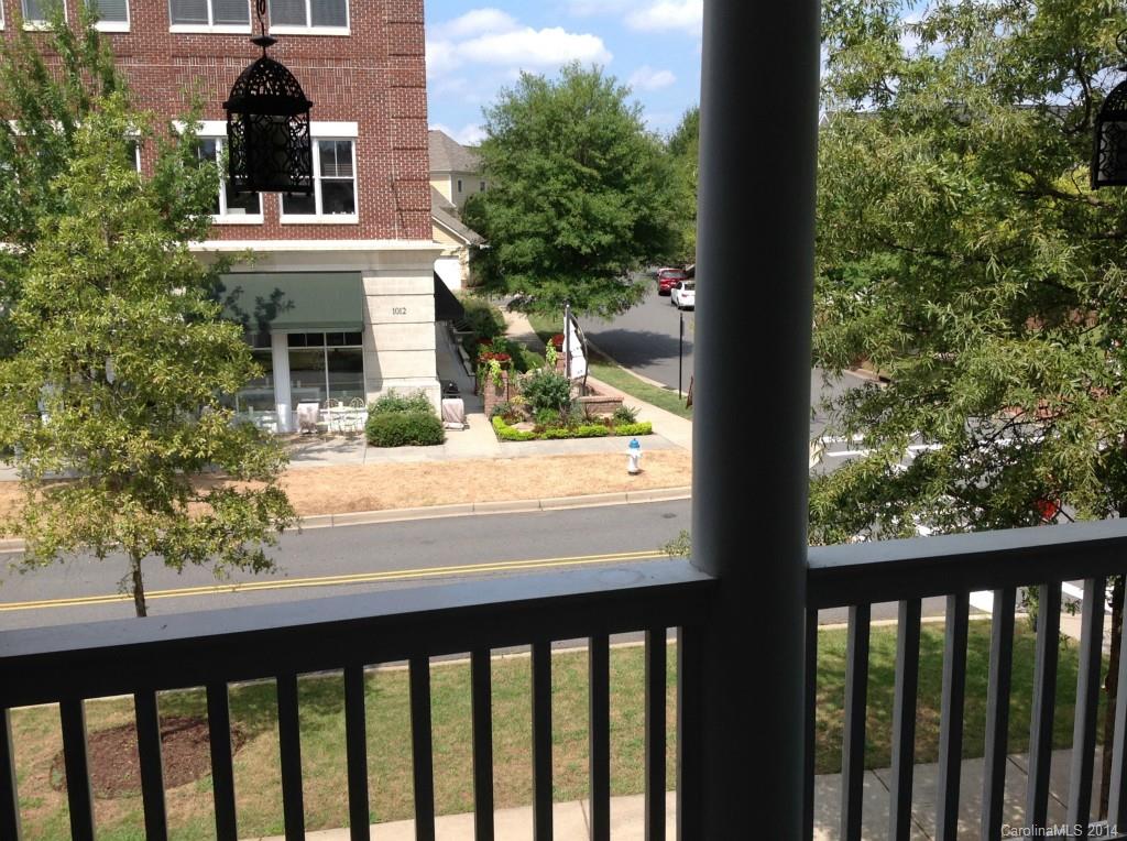 1195 Springmaid Avenue Fort Mill, SC 29708 - Photo 3 of 22 a view of a brick house with a tree in front