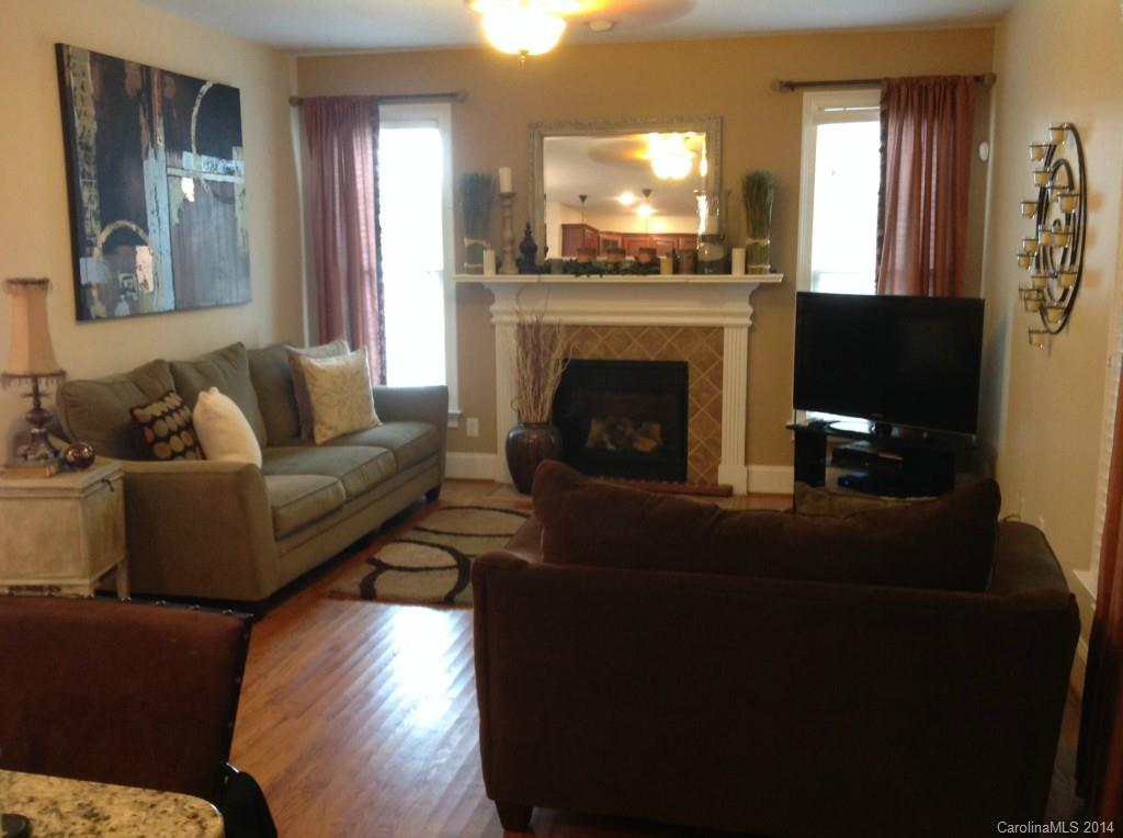 1195 Springmaid Avenue Fort Mill, SC 29708 - Photo 5 of 22 a living room with furniture and a fireplace