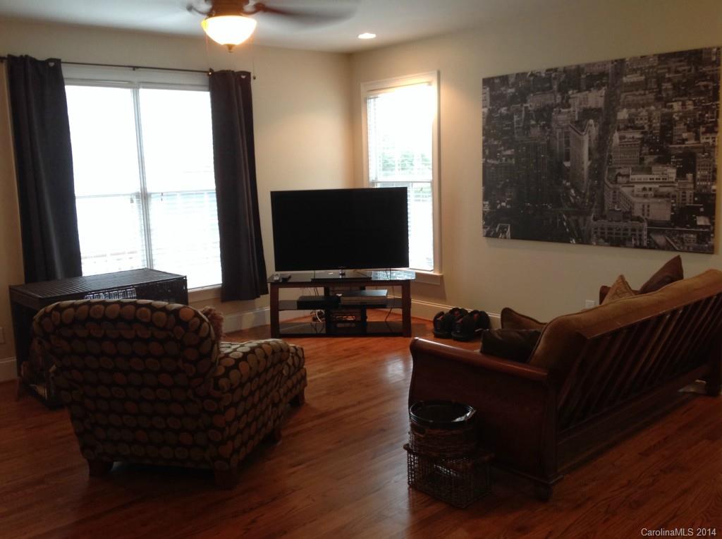 1195 Springmaid Avenue Fort Mill, SC 29708 - Photo 10 of 22 a living room with furniture and a flat screen tv