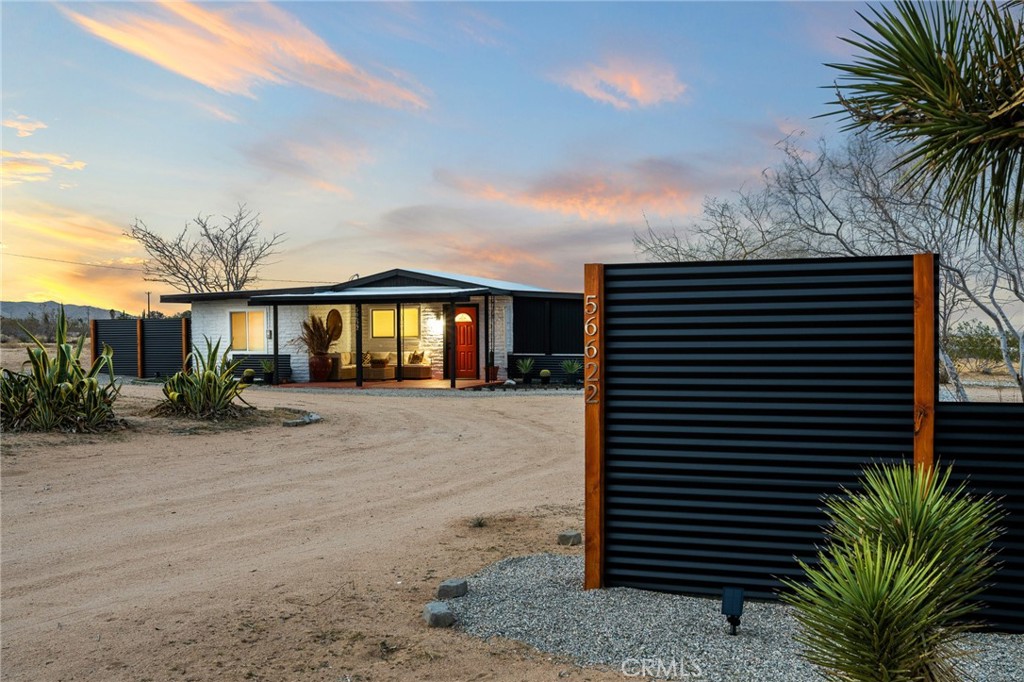 56622 Handley Road Yucca Valley, CA 92284 - Photo 1 of 1 a front view of a house with a garden