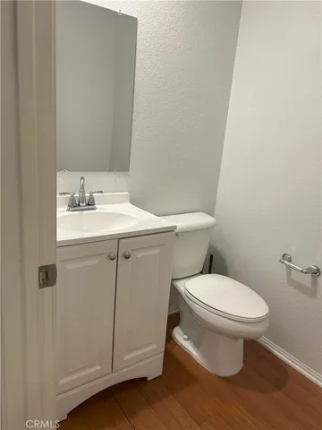 a white toilet sitting next to a bathroom sink