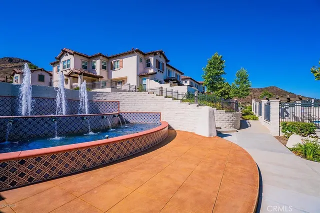 a view of a swimming pool with a lounge chair