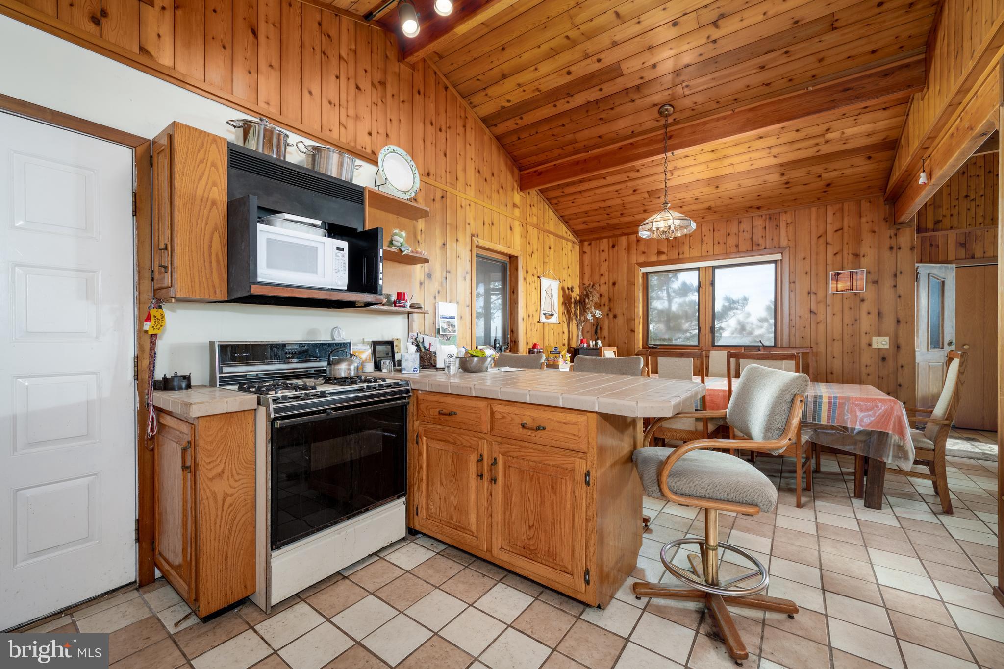 20174 Nanticoke Road Nanticoke, MD 21840 - Photo 29 of 48 a kitchen with stainless steel appliances granite countertop a stove a sink and a microwave