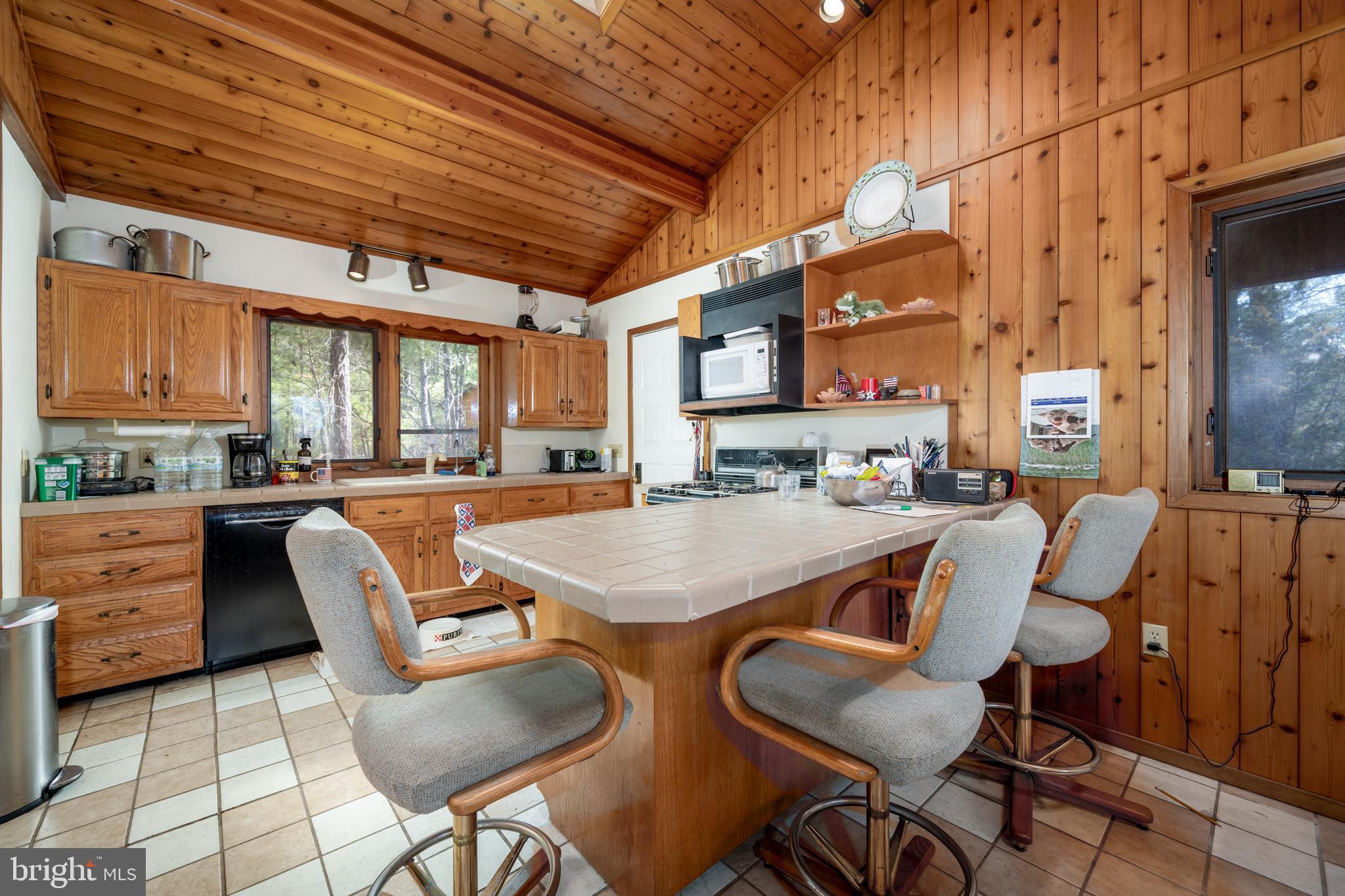 20174 Nanticoke Road Nanticoke, MD 21840 - Photo 30 of 48 a dinning table and chairs in the kitchen