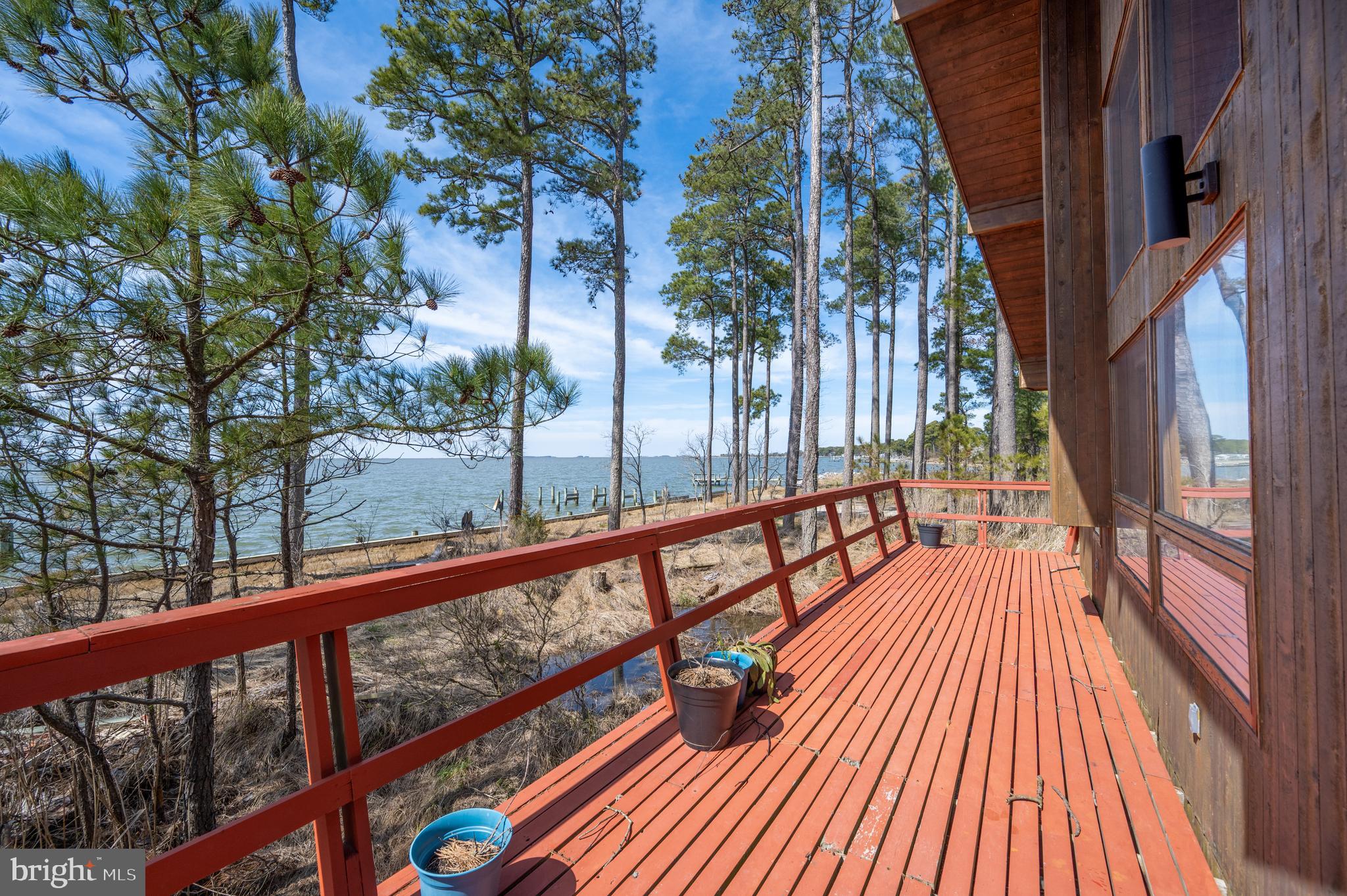 20174 Nanticoke Road Nanticoke, MD 21840 - Photo 38 of 48 a view of balcony with wooden floor and outdoor seating