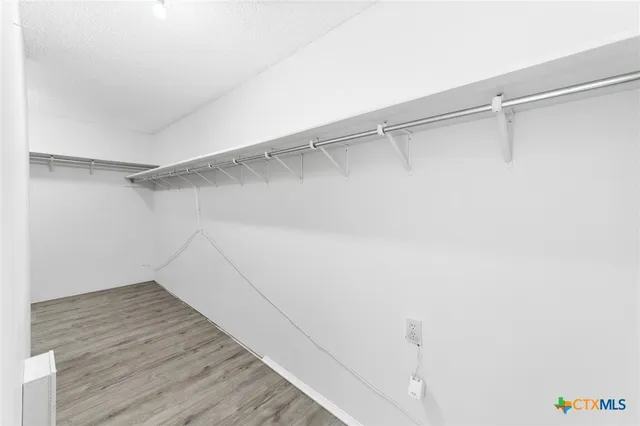 a view of an empty walk in closet