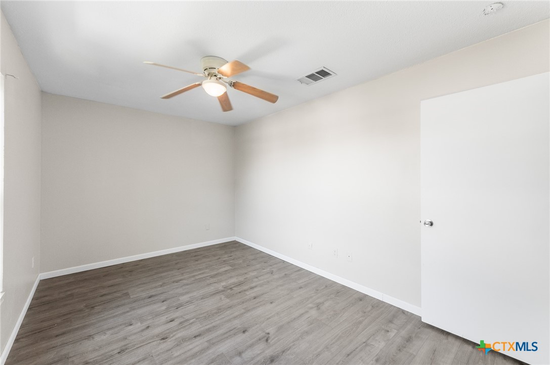 8010 Chestnut Gate Lane Converse, TX 78109 - Photo 28 of 35 a view of an empty room with wooden floor