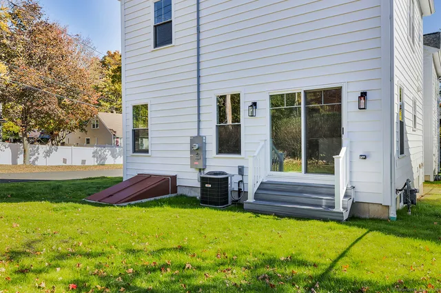 a swimming pool with outdoor seating and yard