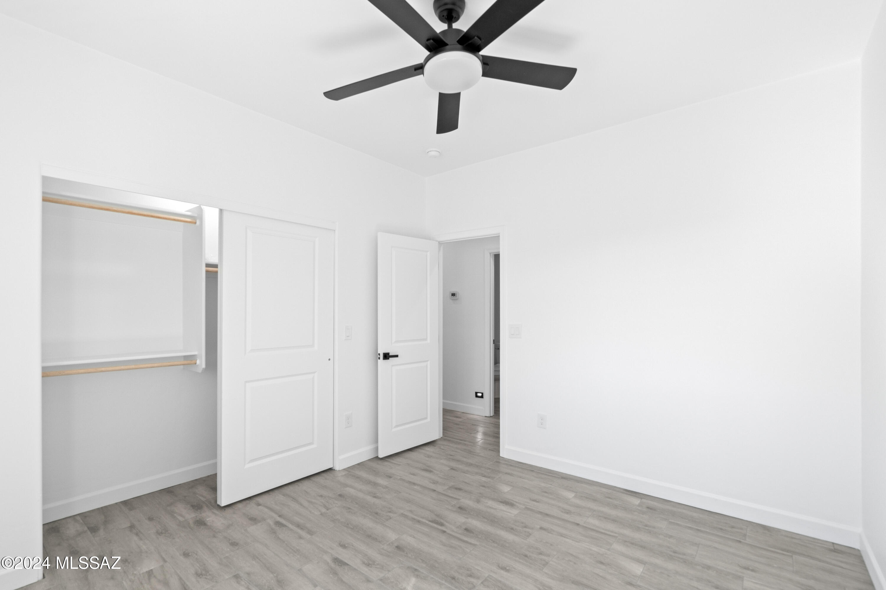 1874 Circulo Colombia Rio Rico, AZ 85648 - Photo 20 of 31 a view of an empty room with wooden floor