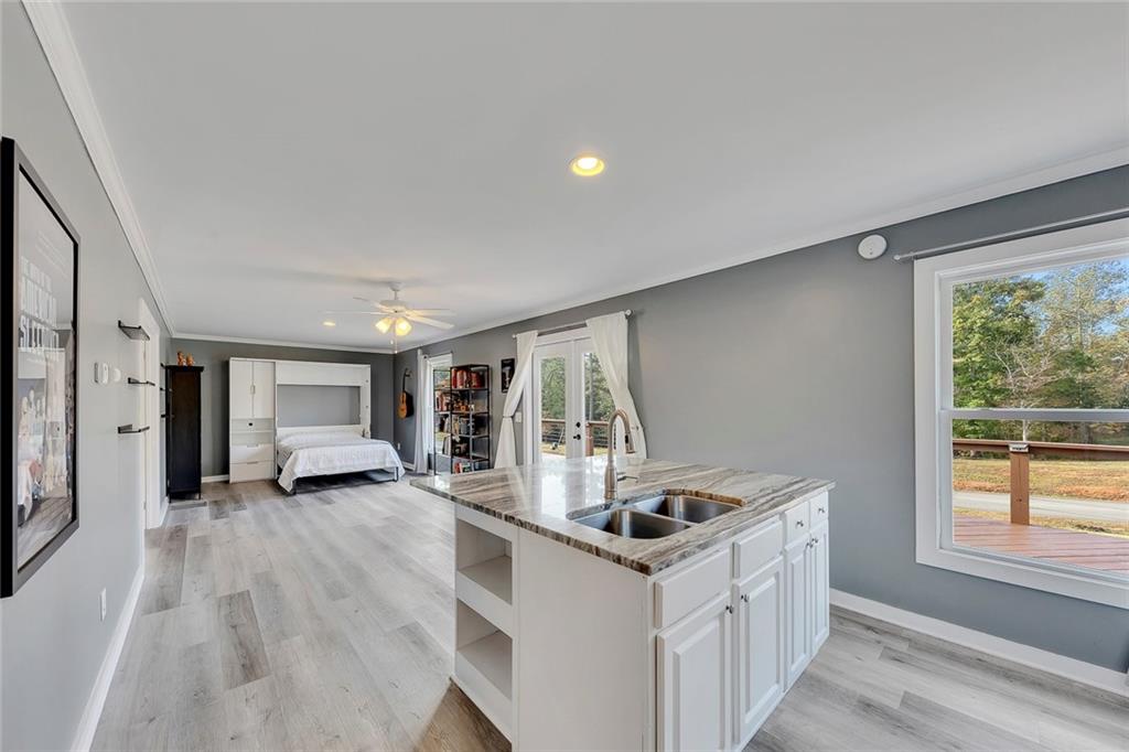 801 Town Creek Church Road Talking Rock, GA 30175 - Photo 28 of 58 a kitchen that has a sink and a stove with wooden floor