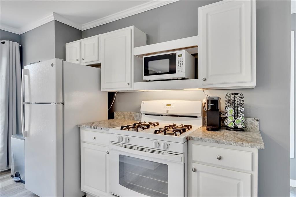801 Town Creek Church Road Talking Rock, GA 30175 - Photo 31 of 58 a kitchen with cabinets stainless steel appliances and a counter space