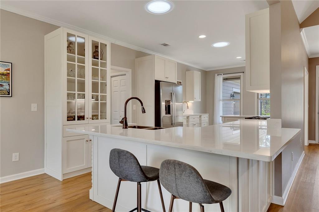 801 Town Creek Church Road Talking Rock, GA 30175 - Photo 6 of 58 a kitchen with kitchen island a dining table chairs cabinets and stainless steel appliances