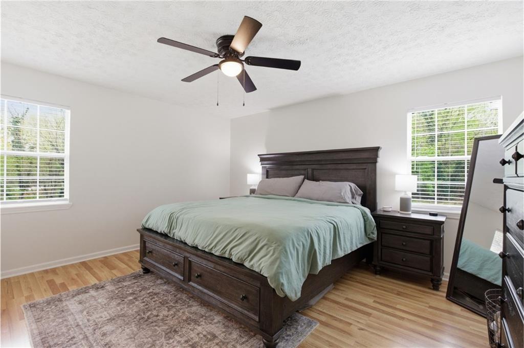 205 Cook Street Alto, GA 30510 - Photo 18 of 40 a bedroom with a bed and a large window