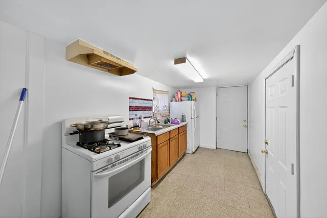 a kitchen with a stove and a sink
