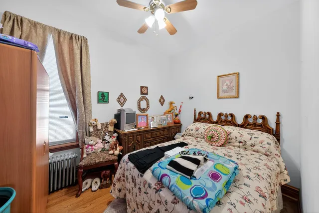 a bedroom with bed and a window