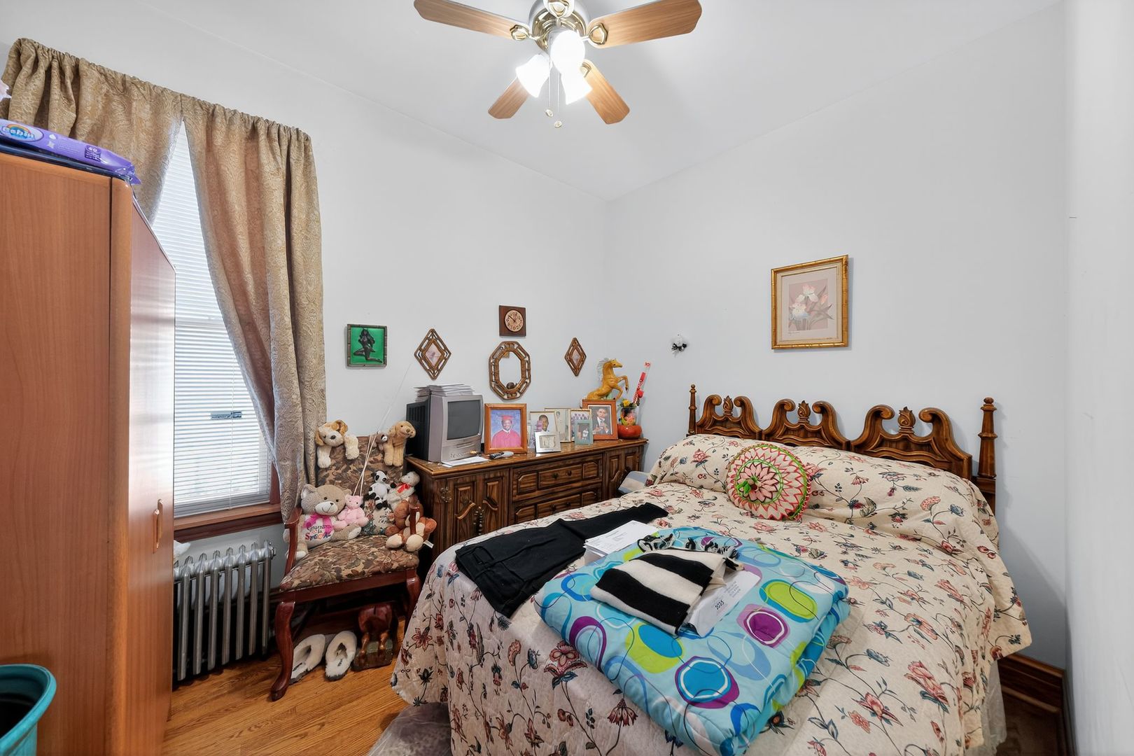 6541 South Carpenter Street Chicago, IL 60621 - Photo 18 of 27 a bedroom with bed and a window