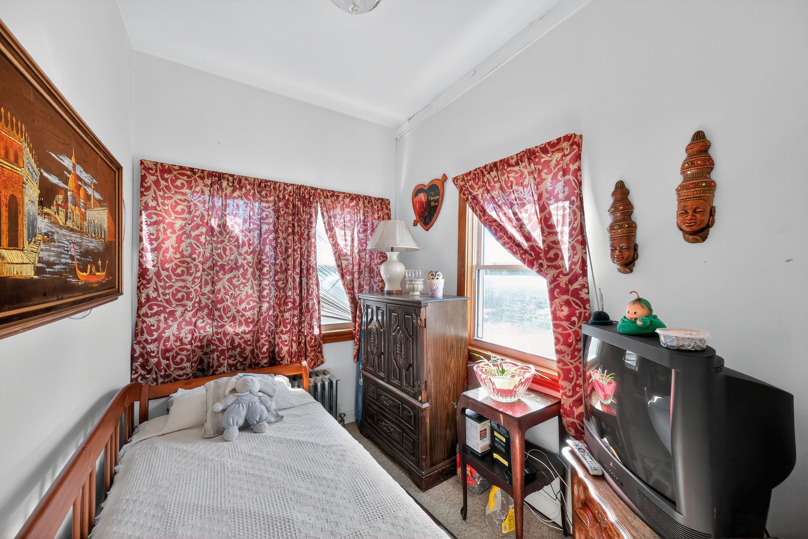 6541 South Carpenter Street Chicago, IL 60621 - Photo 21 of 27 a bedroom with a bed and wooden floor