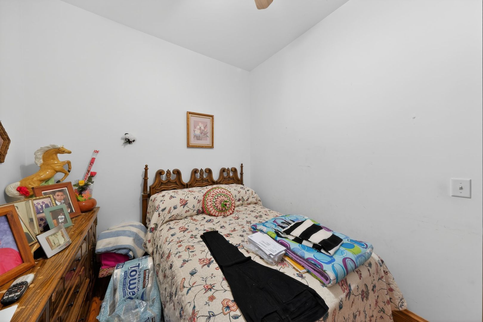 6541 South Carpenter Street Chicago, IL 60621 - Photo 23 of 27 a bedroom with a bed and a wooden floor