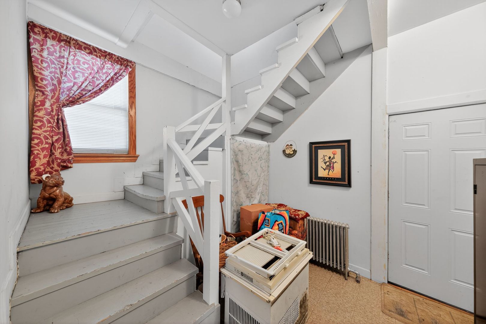6541 South Carpenter Street Chicago, IL 60621 - Photo 26 of 27 a living room with furniture and stairs