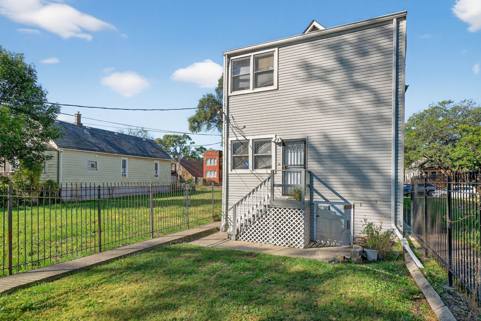 6541 South Carpenter Street Chicago, IL 60621 - Photo 7 of 27 a view of a porch with a yard