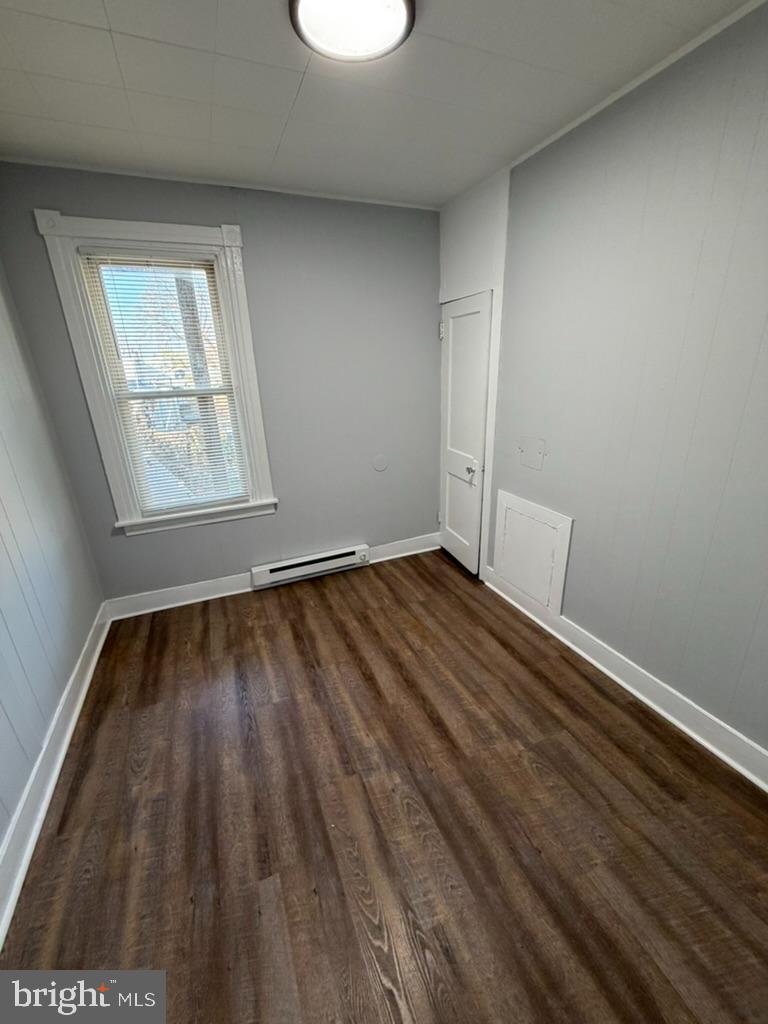 1410 Huddell Avenue Marcus Hook, PA 19061 - Photo 12 of 29 an empty room with wooden floor and windows