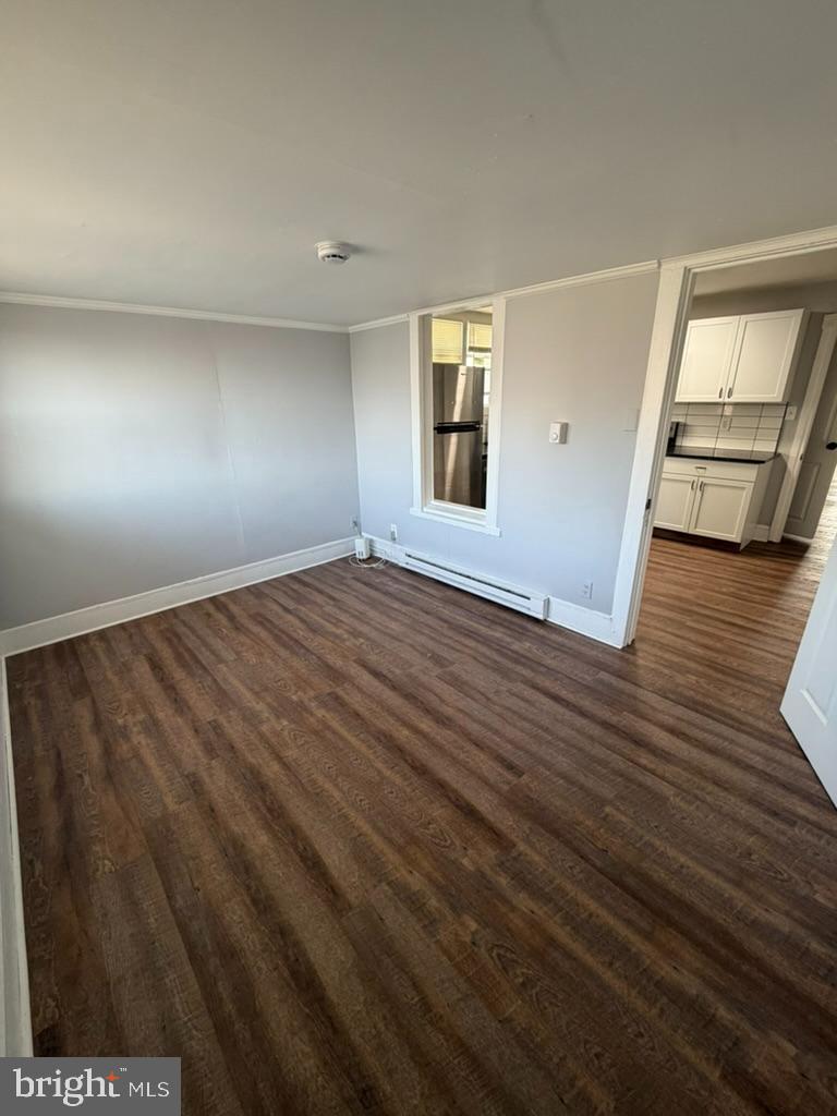 1410 Huddell Avenue Marcus Hook, PA 19061 - Photo 16 of 29 an empty room with wooden floor and windows