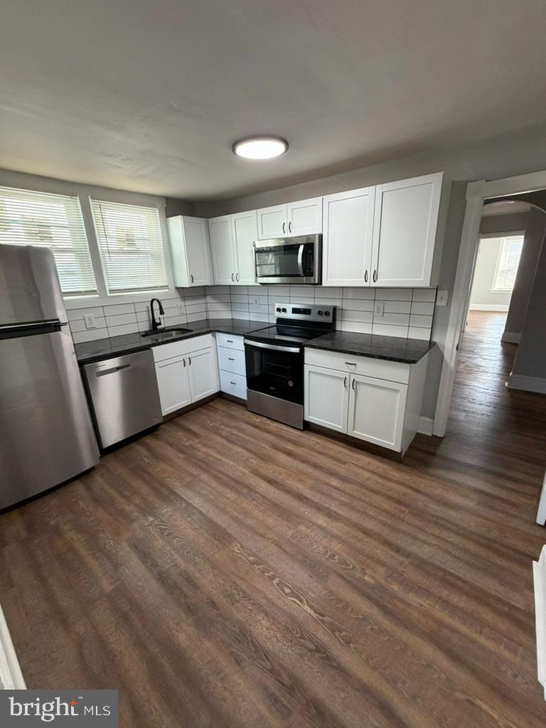 1410 Huddell Avenue Marcus Hook, PA 19061 - Photo 18 of 29 a large kitchen with stainless steel appliances granite countertop a large counter top and a stove top oven