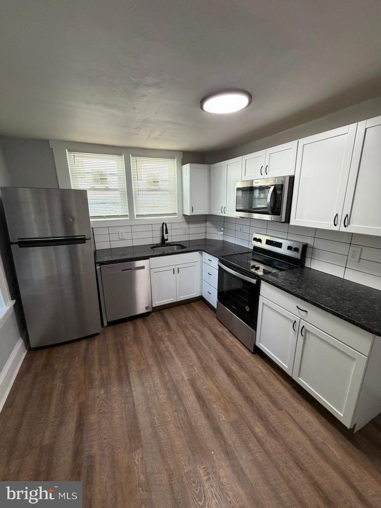 1410 Huddell Avenue Marcus Hook, PA 19061 - Photo 19 of 29 a kitchen with stainless steel appliances granite countertop a stove a sink and a refrigerator