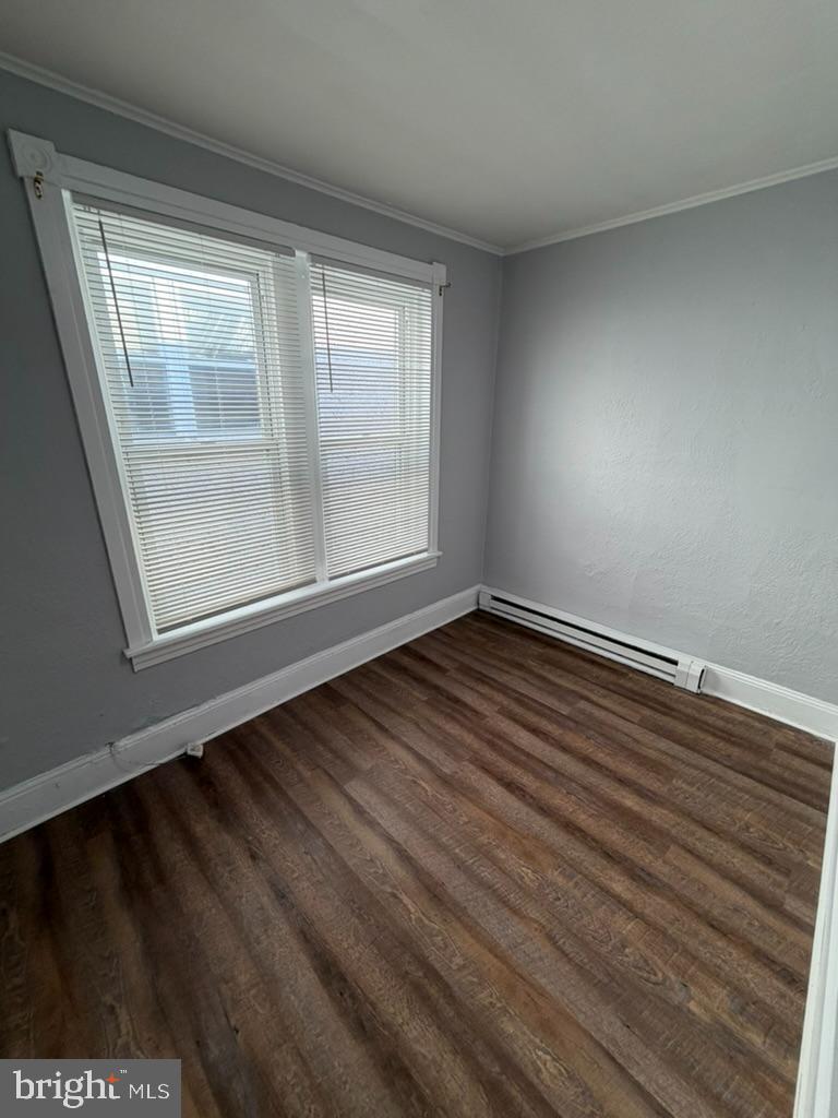 1410 Huddell Avenue Marcus Hook, PA 19061 - Photo 26 of 29 a view of an empty room with wooden floor and a window
