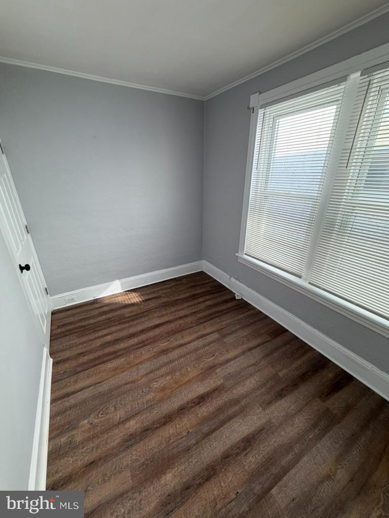 1410 Huddell Avenue Marcus Hook, PA 19061 - Photo 27 of 29 a view of an empty room with wooden floor and a window