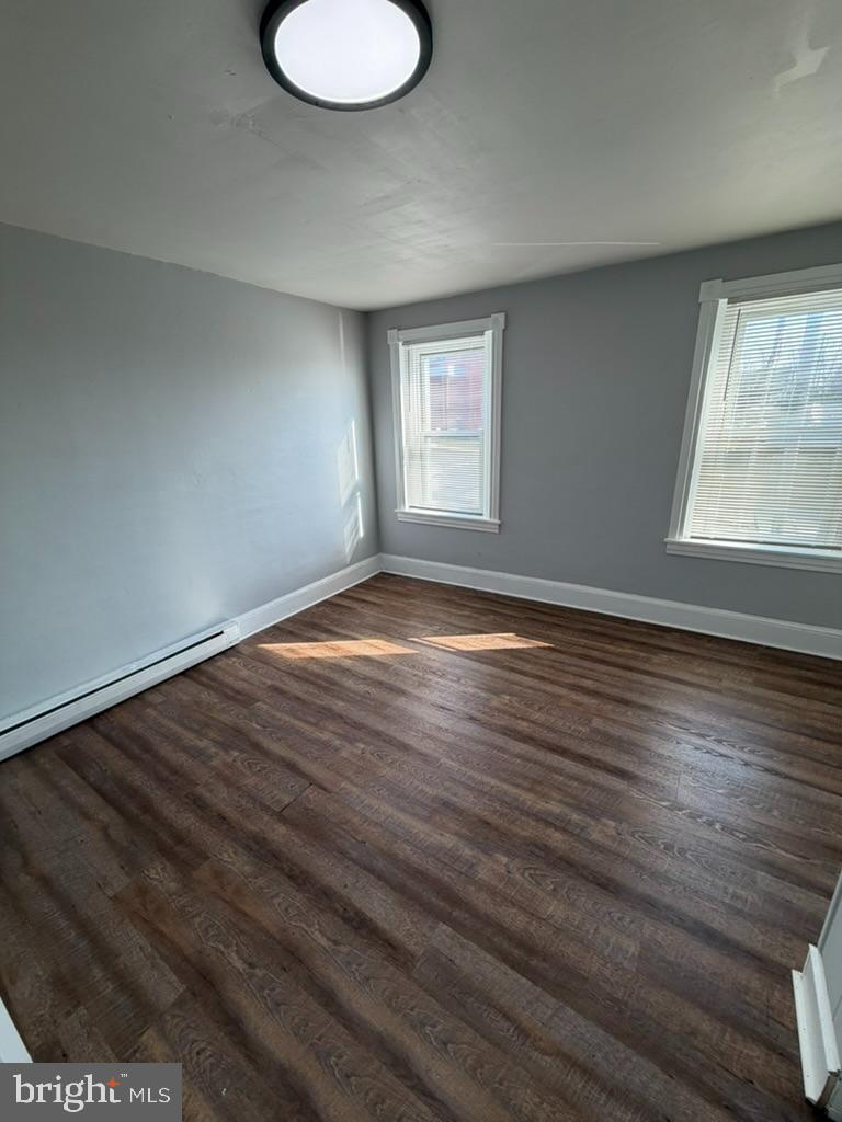 1410 Huddell Avenue Marcus Hook, PA 19061 - Photo 28 of 29 a view of an empty room with wooden floor and a window