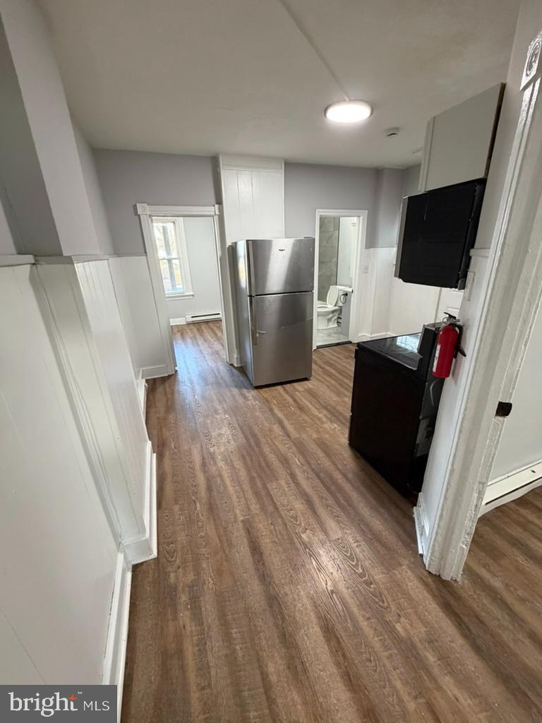 1410 Huddell Avenue Marcus Hook, PA 19061 - Photo 5 of 29 a living room with furniture and a flat screen tv