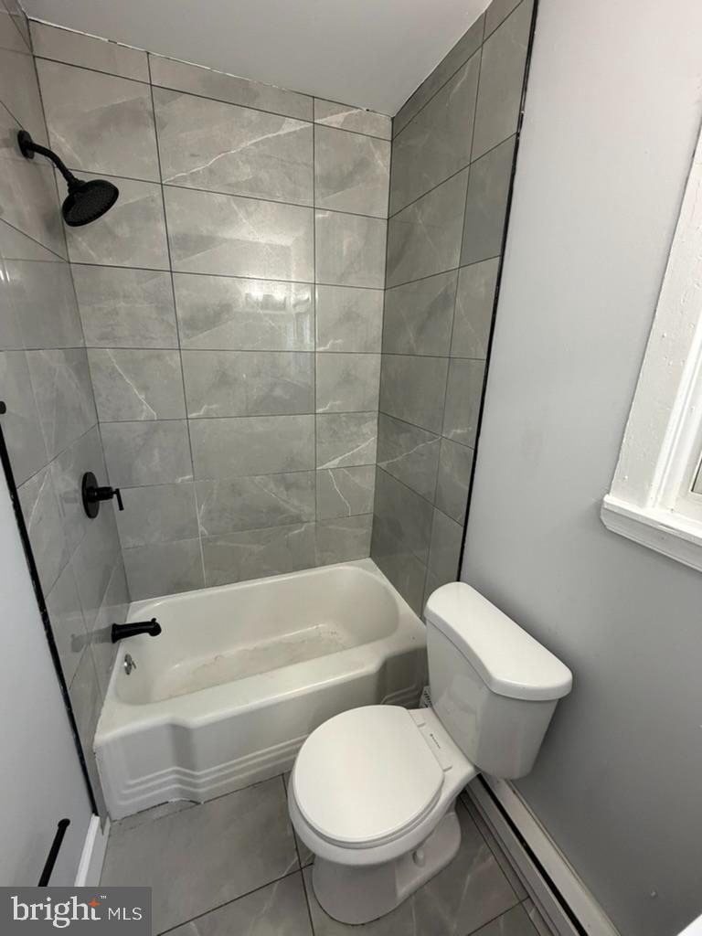 1410 Huddell Avenue Marcus Hook, PA 19061 - Photo 10 of 29 a bathroom with a toilet and a bath tub