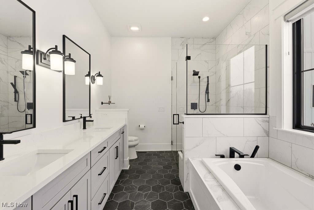 2941 Southern Road Richfield, OH 44286 - Photo 28 of 50 Bathroom featuring a garden tub, a marble finish shower, double vanity, and recessed lighting