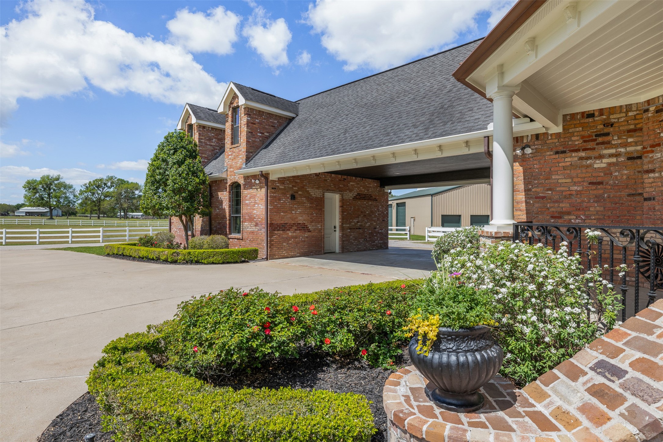 29500 Skymac Ranch Road Hempstead, TX 77445 - Photo 6 of 50 a front view of a house with a yard and potted plants