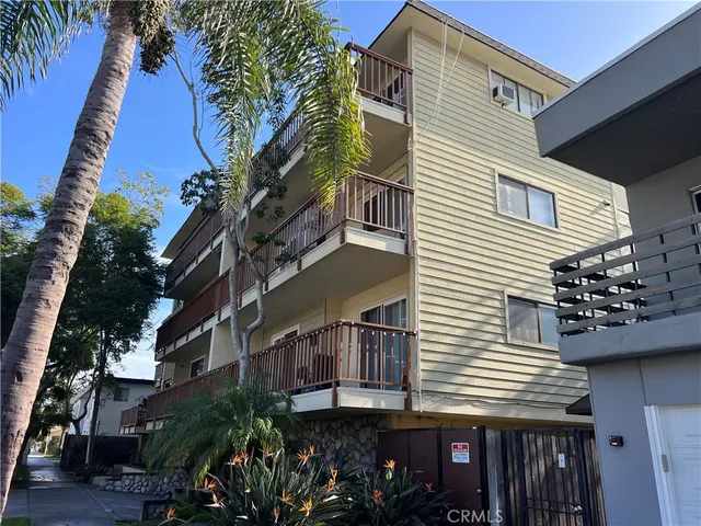 a bedroom with a bed and a large mirror