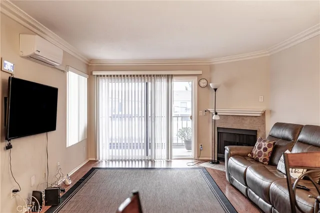 a living room with furniture fireplace and flat screen tv