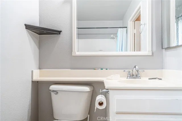 a bathroom with a toilet and bathtub