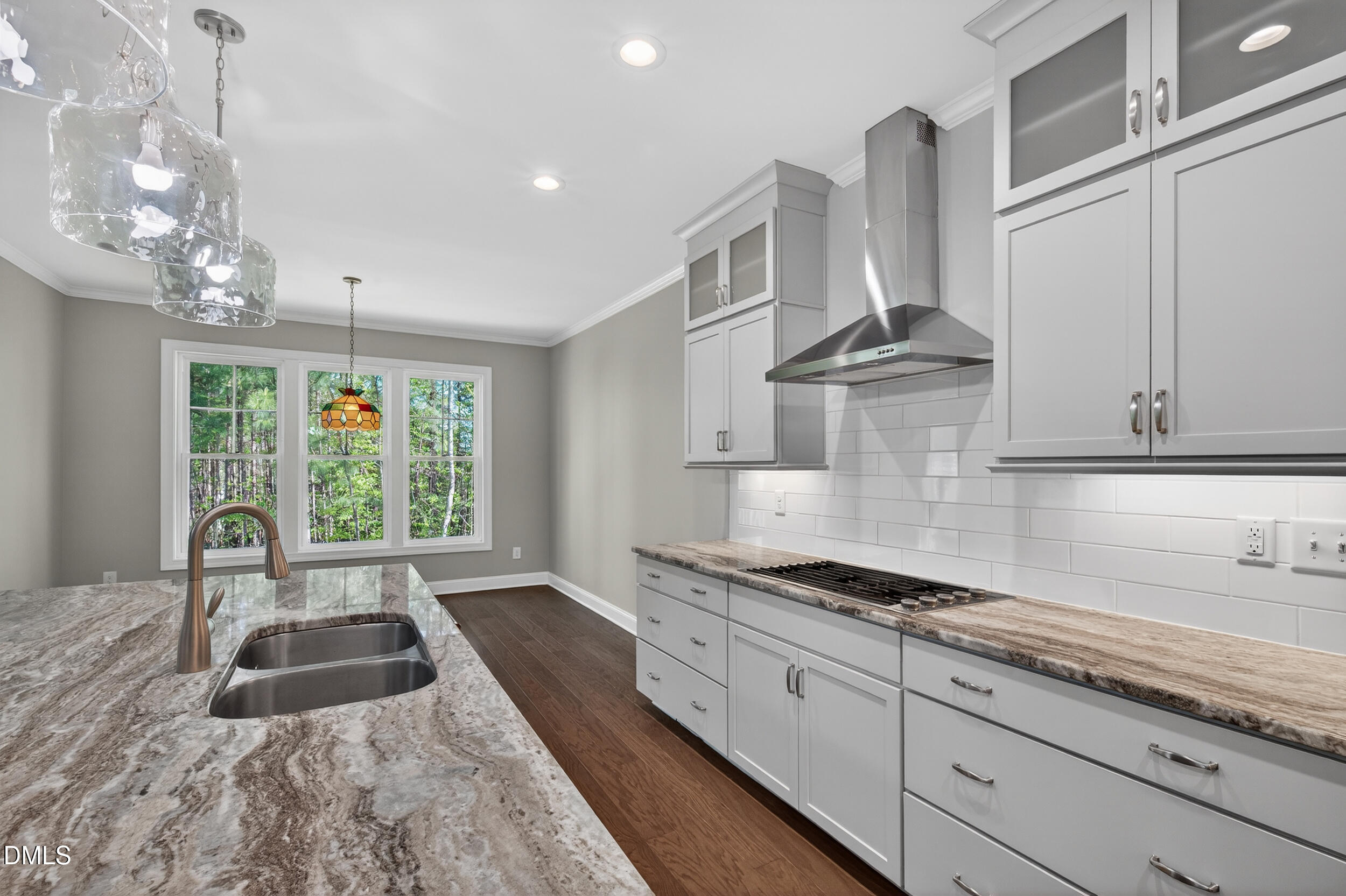 231 High Ridge Lane Pittsboro, NC 27312 - Photo 18 of 47 a large white kitchen with cabinets a sink a stove and a window