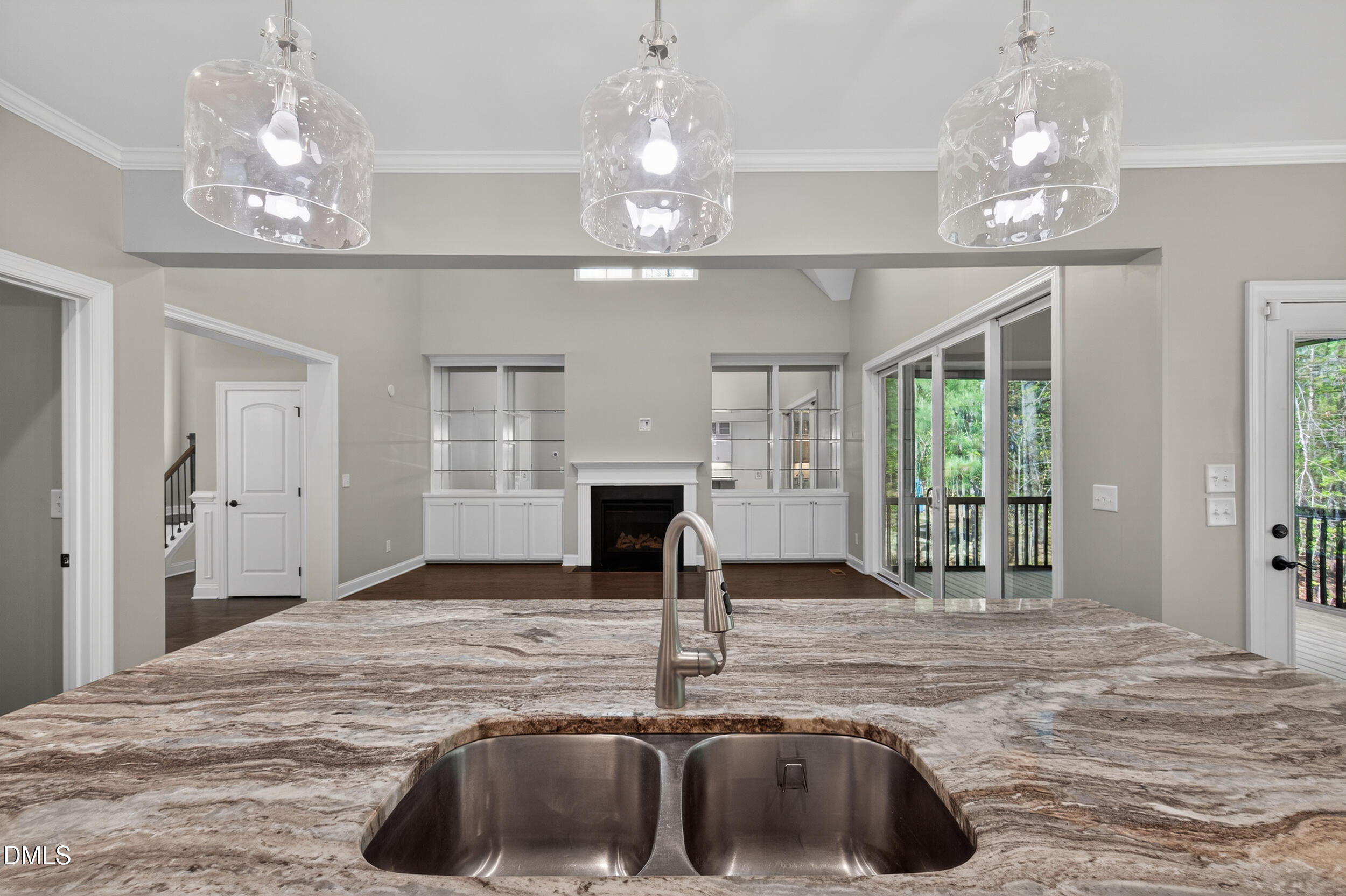 231 High Ridge Lane Pittsboro, NC 27312 - Photo 19 of 47 a kitchen with kitchen island a chandelier and living room view