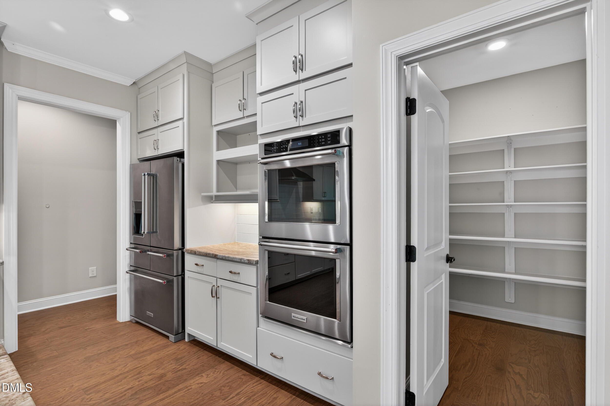 231 High Ridge Lane Pittsboro, NC 27312 - Photo 20 of 47 a kitchen with stainless steel appliances and cabinets