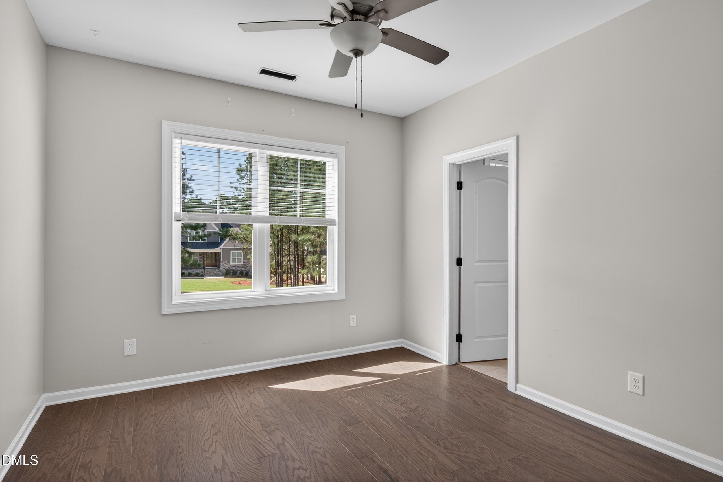 231 High Ridge Lane Pittsboro, NC 27312 - Photo 32 of 47 a view of an empty room with a window and wooden floor