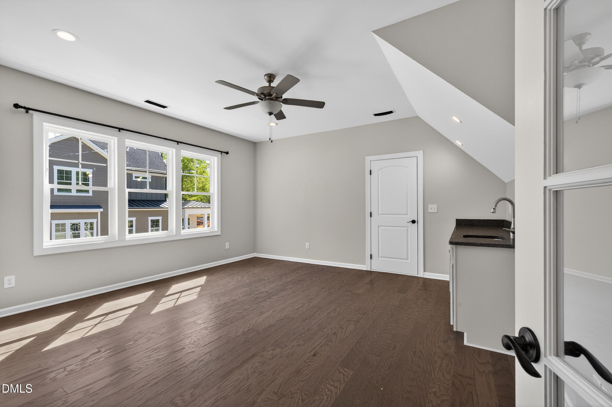 231 High Ridge Lane Pittsboro, NC 27312 - Photo 34 of 47 a view of an empty room with a window and wooden floor