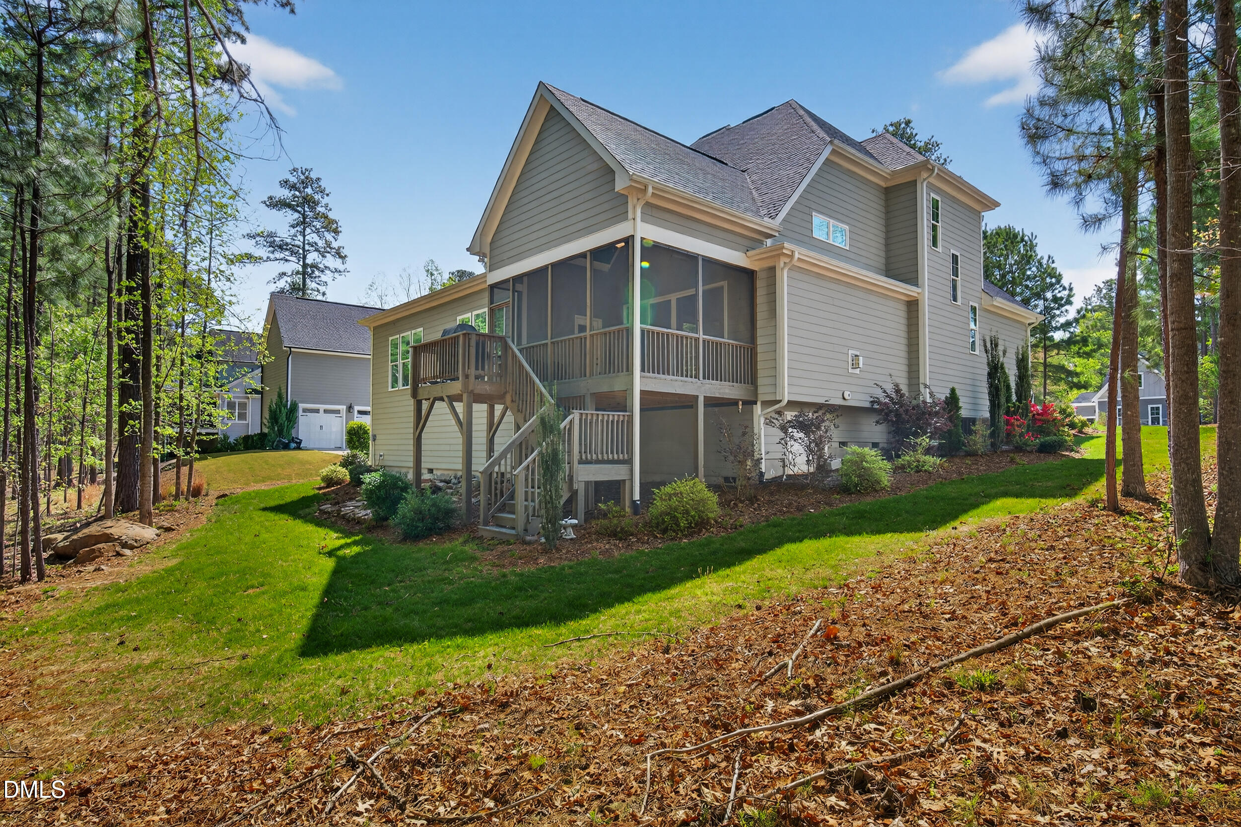 231 High Ridge Lane Pittsboro, NC 27312 - Photo 43 of 47 a view of a white house next to a yard and a large tree