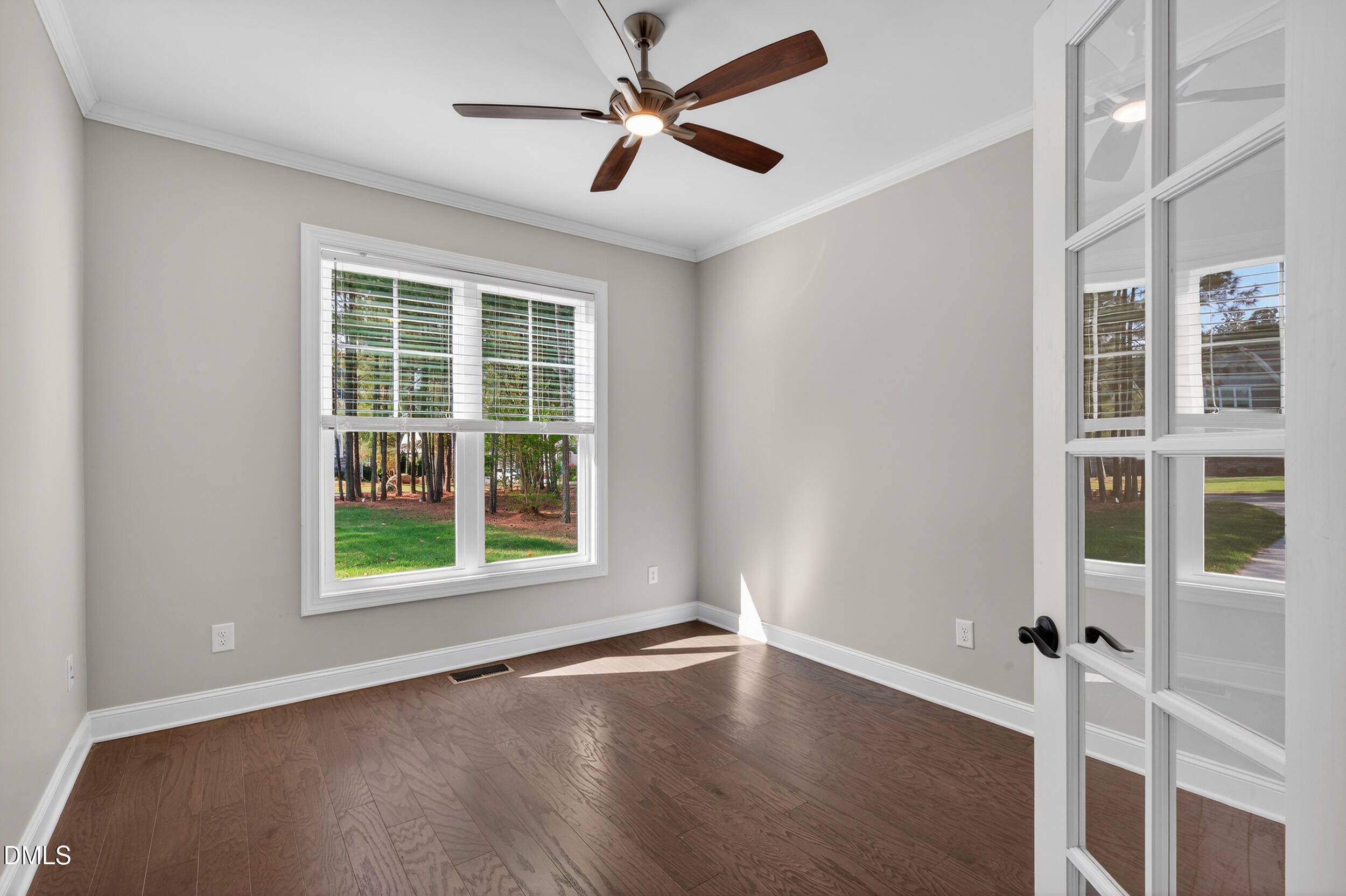 231 High Ridge Lane Pittsboro, NC 27312 - Photo 9 of 47 an empty room with wooden floor and windows