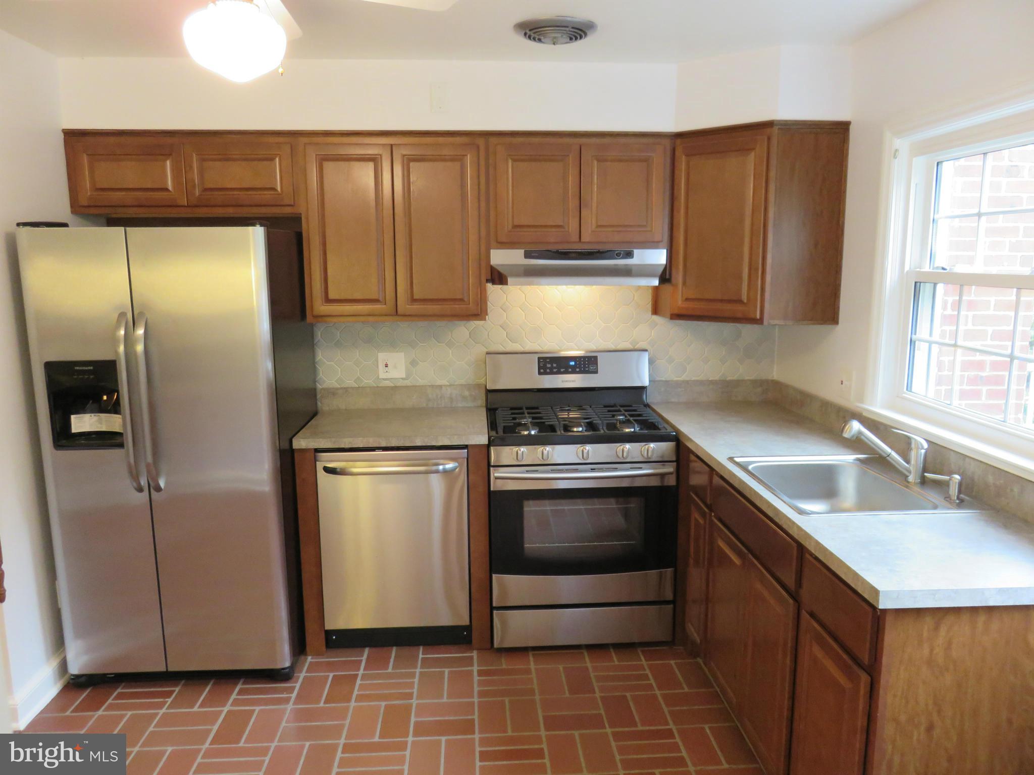 1930 Edgewood Road Baltimore, MD 21286 - Photo 2 of 30 a kitchen with a sink appliances and cabinets