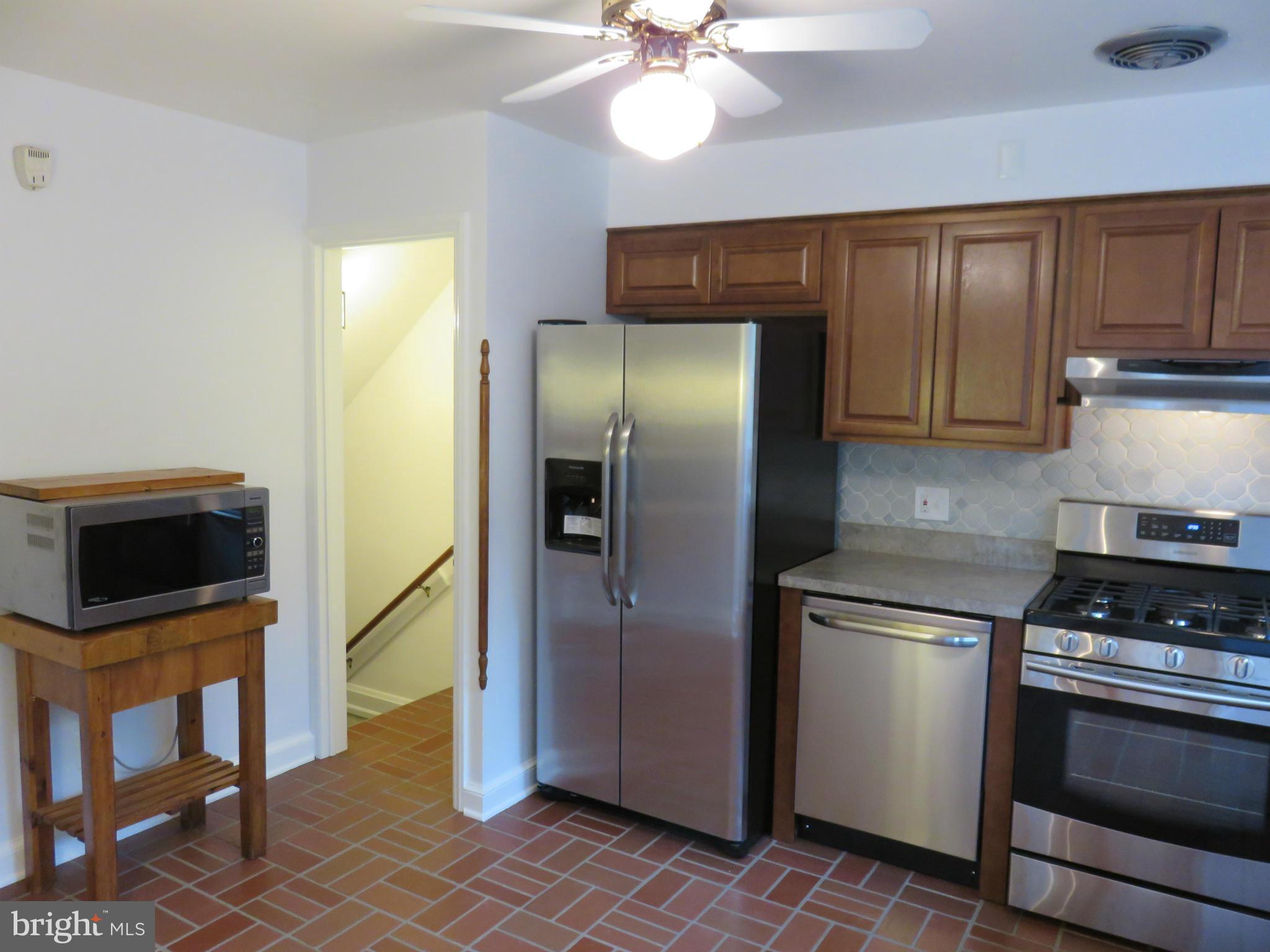 1930 Edgewood Road Baltimore, MD 21286 - Photo 11 of 30 a kitchen with stainless steel appliances a refrigerator and a stove top oven
