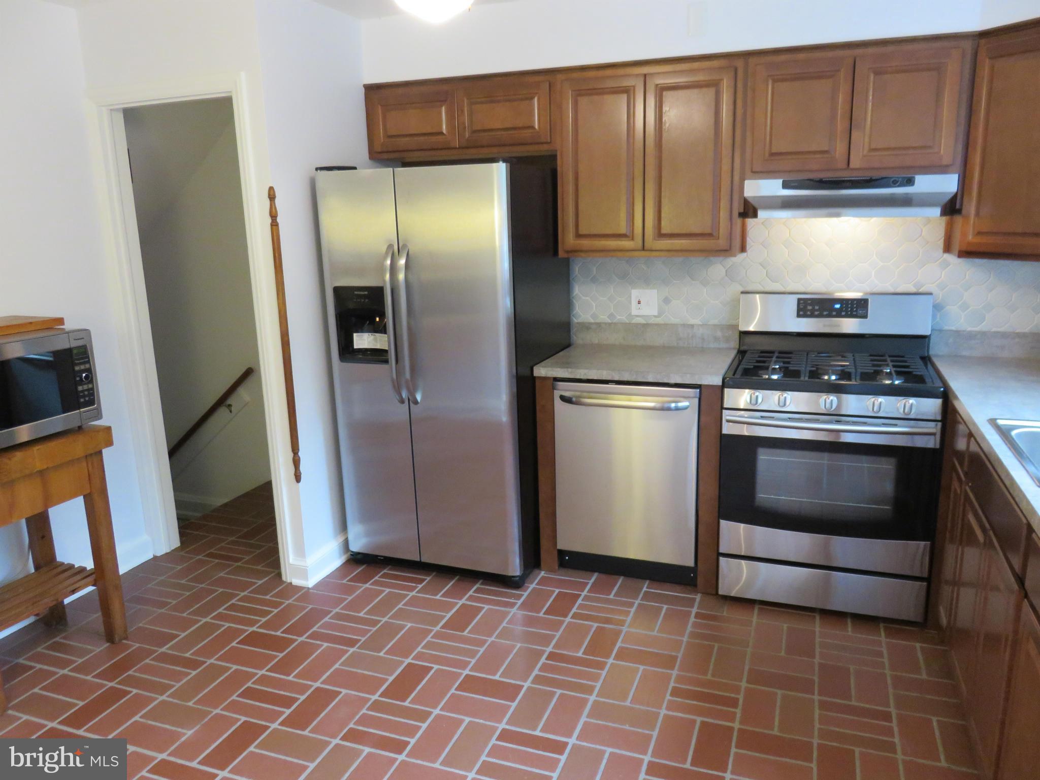 1930 Edgewood Road Baltimore, MD 21286 - Photo 12 of 30 a kitchen with a stove and a refrigerator