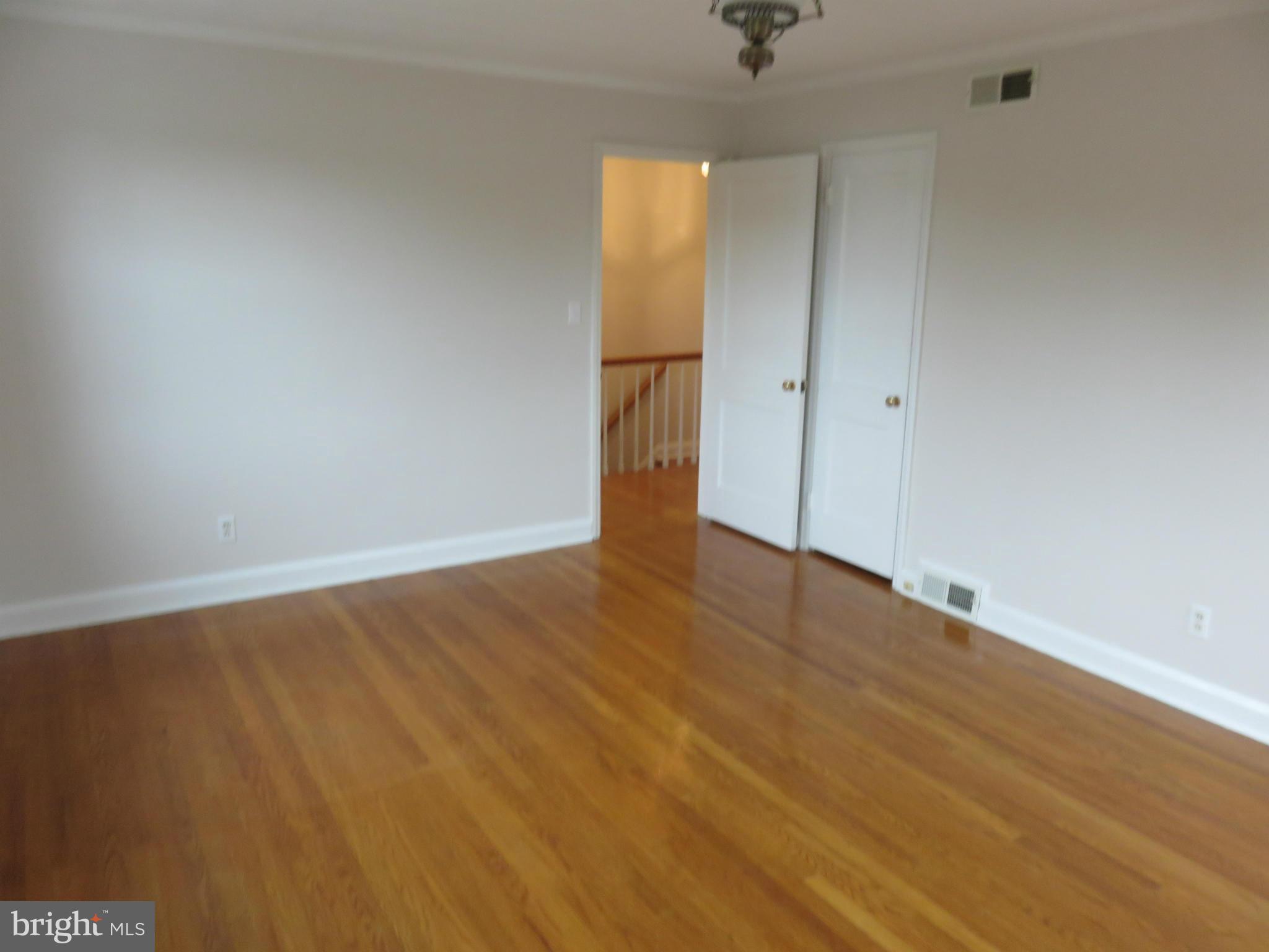 1930 Edgewood Road Baltimore, MD 21286 - Photo 15 of 30 an empty room with wooden floor and door