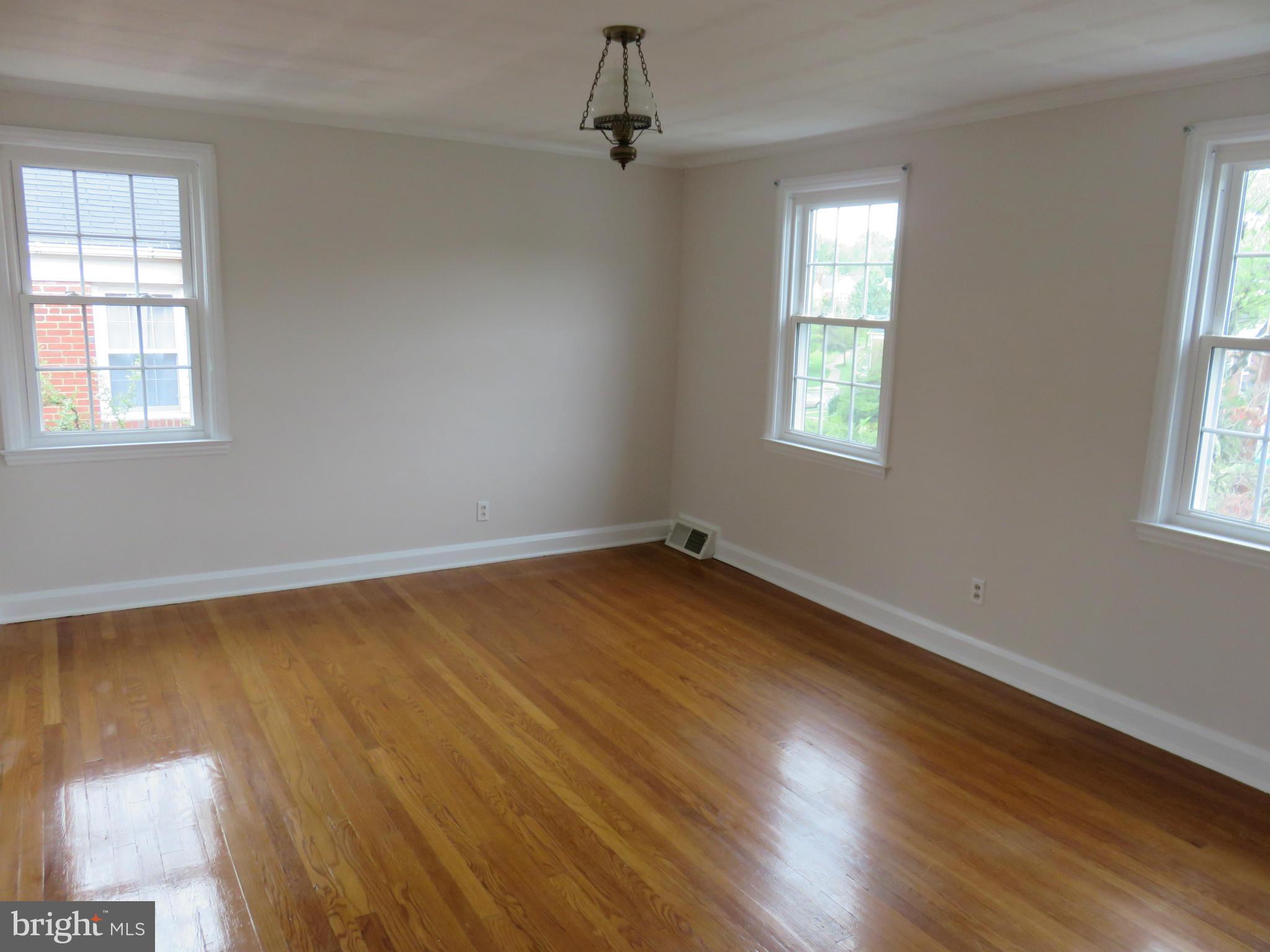 1930 Edgewood Road Baltimore, MD 21286 - Photo 16 of 30 wooden floor in an empty room with a window